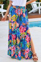 Wild Tropic blue boho maxi skirt with tropical floral print, side splits, tassel tie and flowing tiered hem