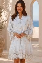 Honeyed Garden white cotton embroidered mini dress with floral cutwork hem and sleeves at Bohemian Love Runway