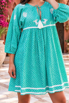 Maya jade cotton boho mini dress with white crab and coral embroidery, tassel neckline and three-quarter sleeves