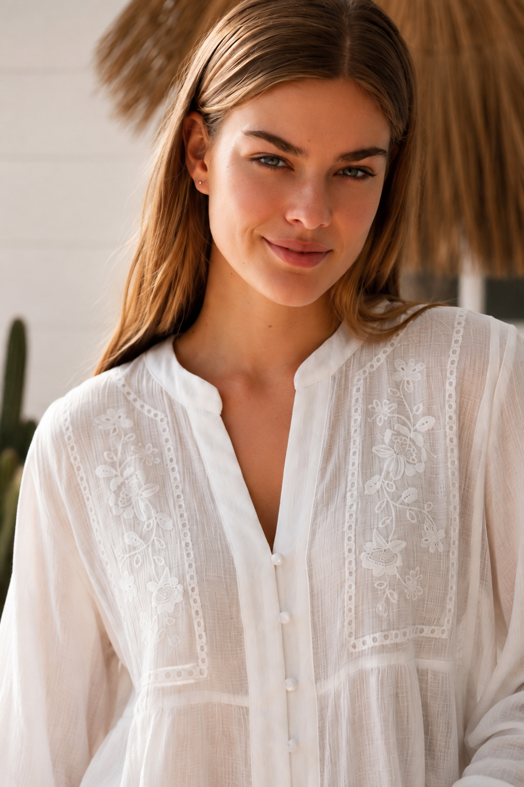 Paige white embroidered blouse by Salty Palm with floral panels, split neckline and long relaxed sleeves