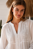 Paige white embroidered blouse by Salty Palm with floral panels, split neckline and long relaxed sleeves