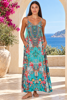 Mirage aqua blue rhinestone maxi dress in viscose crepe with vivid floral placement print and flowing skirt