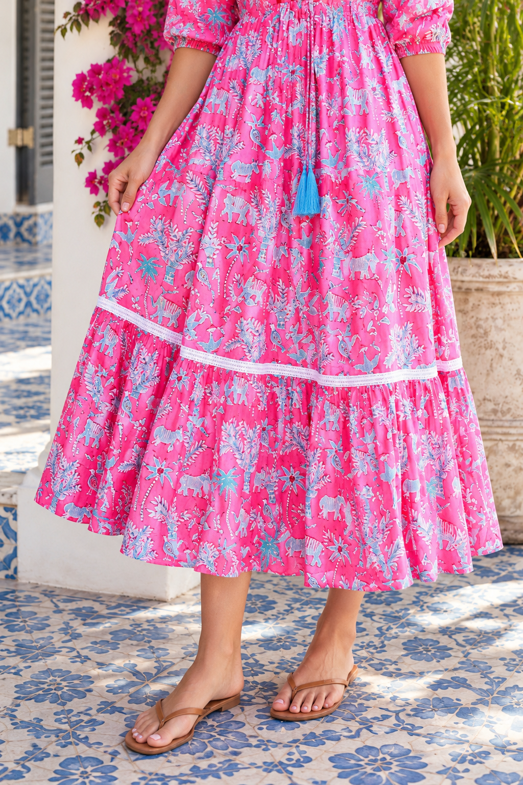 Mahale Sanctuary Midi Dress Pluto Pink in 100% cotton with turquoise wildlife print, white lace trim and frill hem