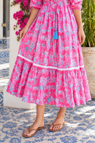 Mahale Sanctuary Midi Dress Pluto Pink in 100% cotton with turquoise wildlife print, white lace trim and frill hem