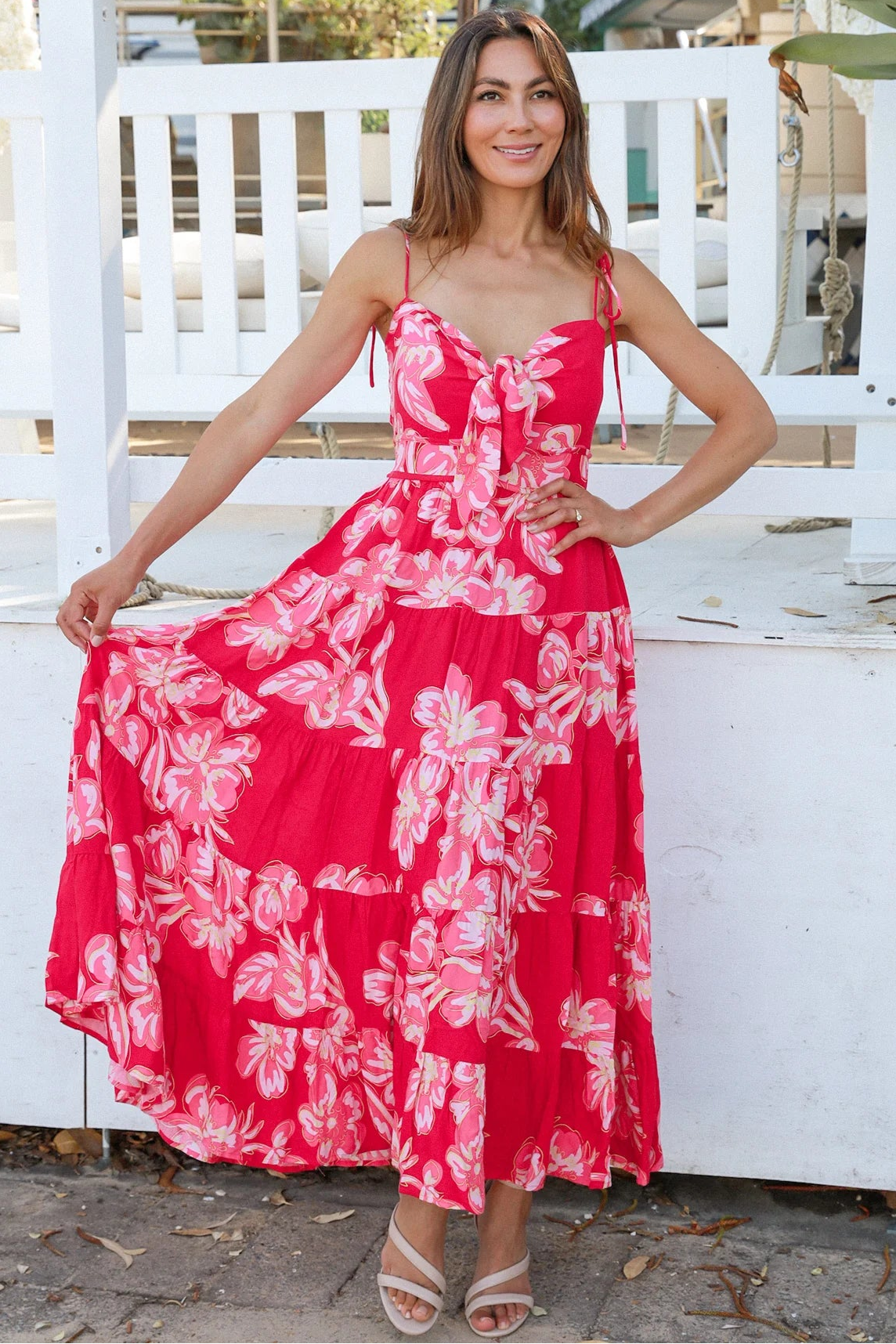 Woman wearing the Zaria Rose Maxi red floral boho maxi dress with tie straps - romantic summer fashion Australia.