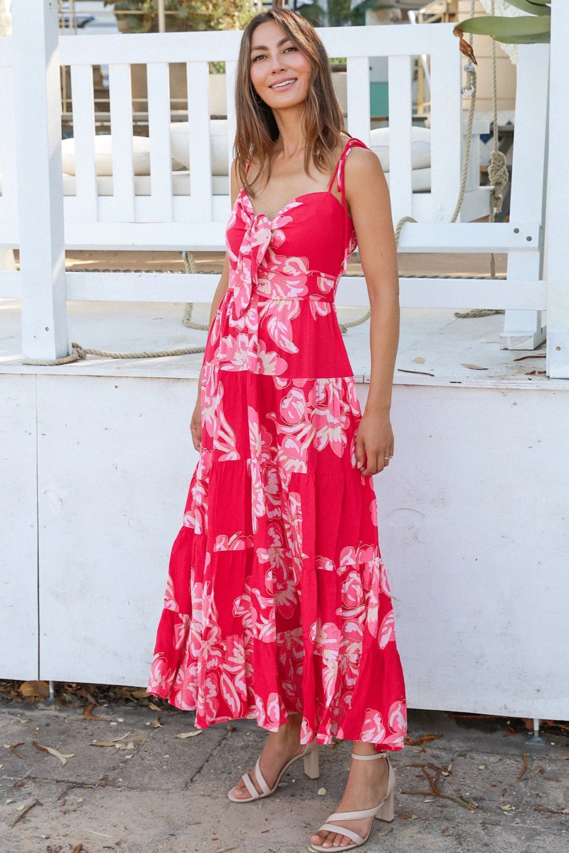 Woman wearing the Zaria Rose Maxi red floral boho maxi dress with tie straps - romantic summer fashion Australia.