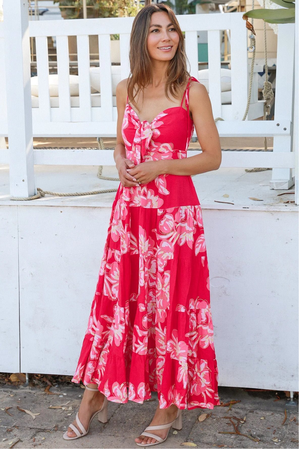 Woman wearing the Zaria Rose Maxi red floral boho maxi dress with tie straps - romantic summer fashion Australia.