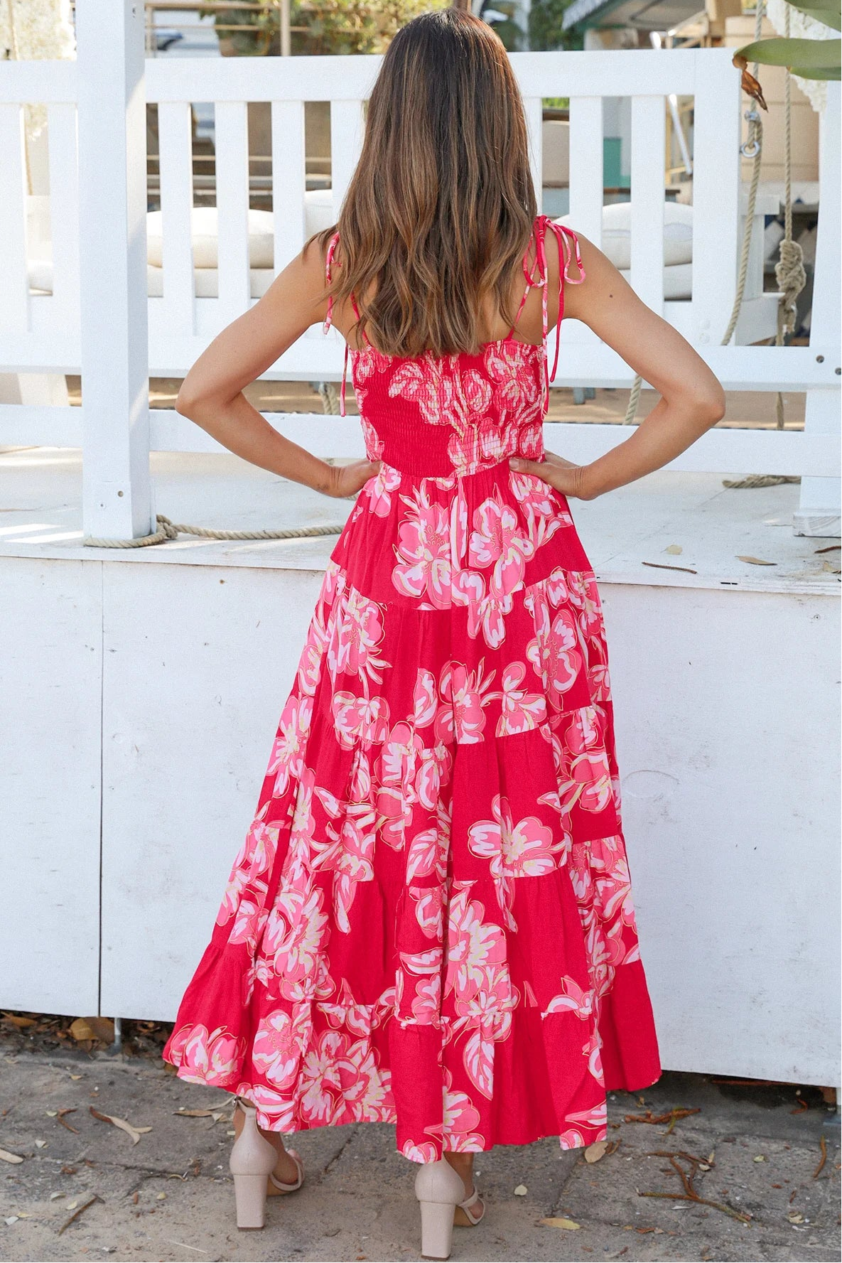 Woman wearing the Zaria Rose Maxi red floral boho maxi dress with tie straps - romantic summer fashion Australia.