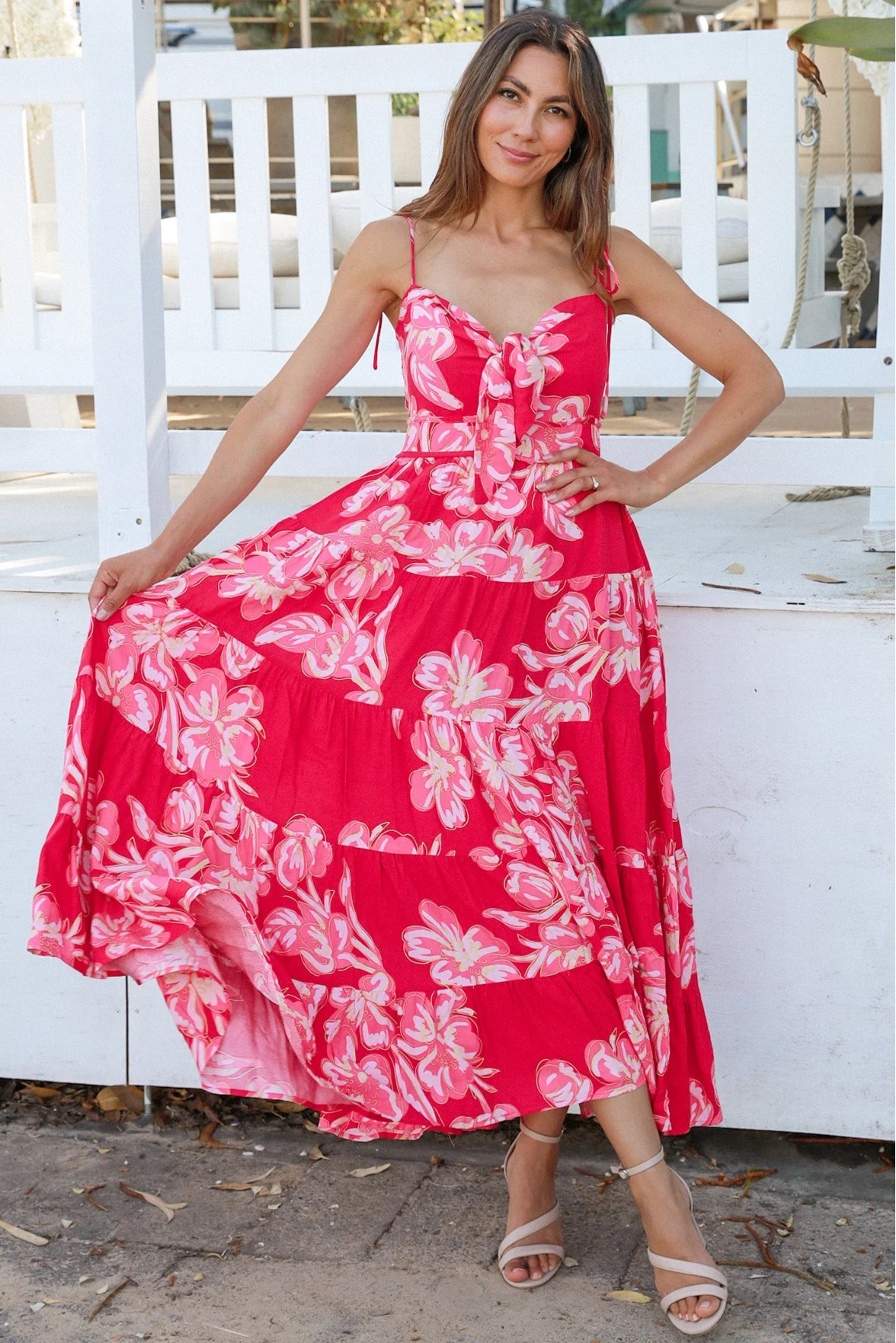 Woman wearing the Zaria Rose Maxi red floral boho maxi dress with tie straps - romantic summer fashion Australia.