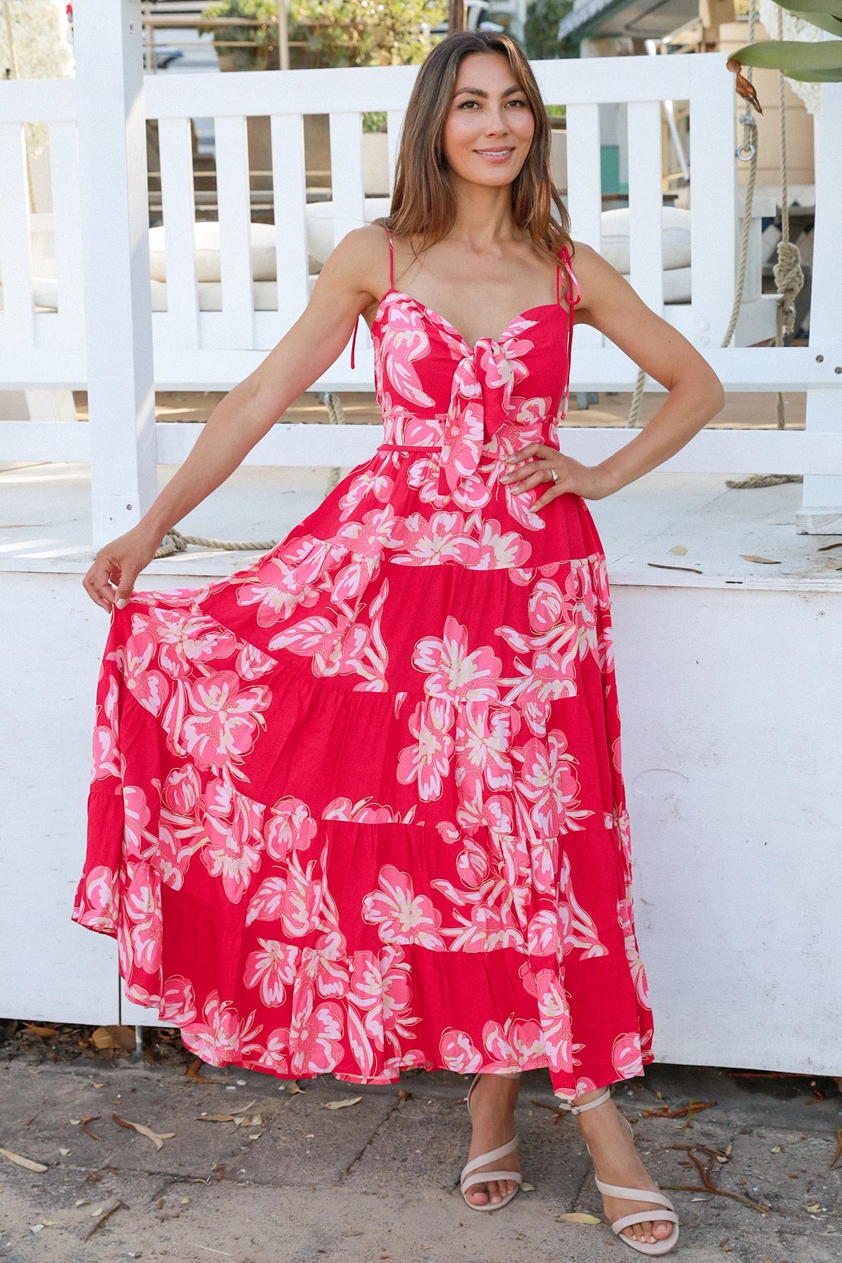 Woman wearing the Zaria Rose Maxi red floral boho maxi dress with tie straps - romantic summer fashion Australia.