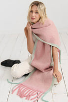 Woman in a blush pink and pastel green winter scarf with brushed texture from Bohemian Love Runway 
