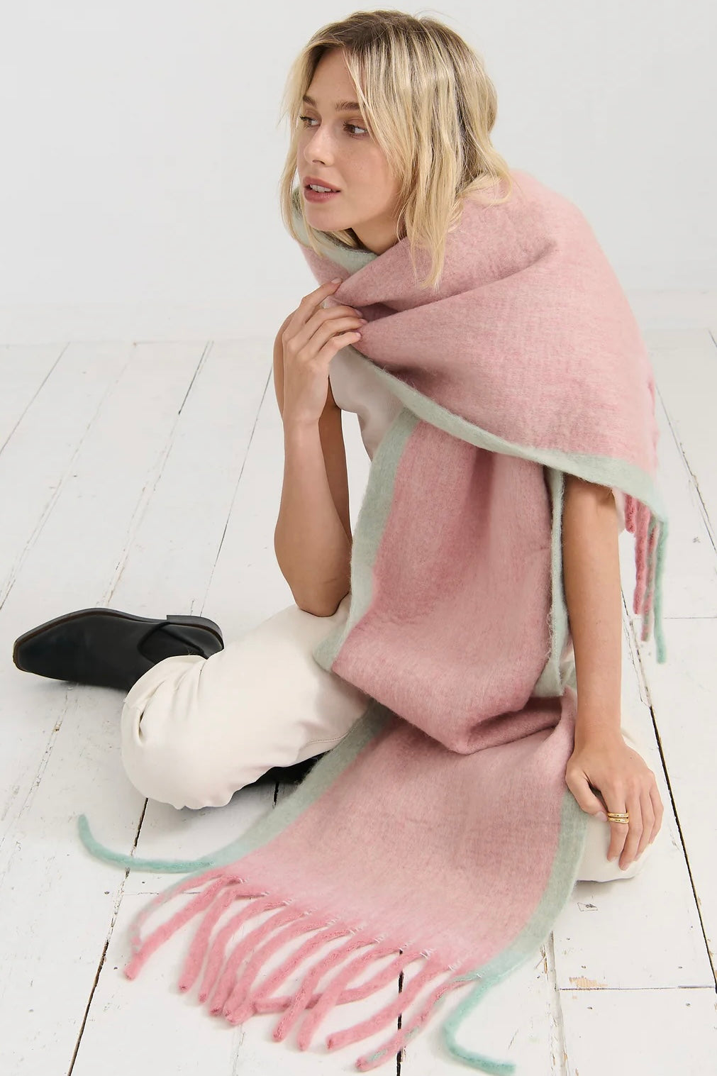 Woman in a blush pink and pastel green winter scarf with brushed texture from Bohemian Love Runway 