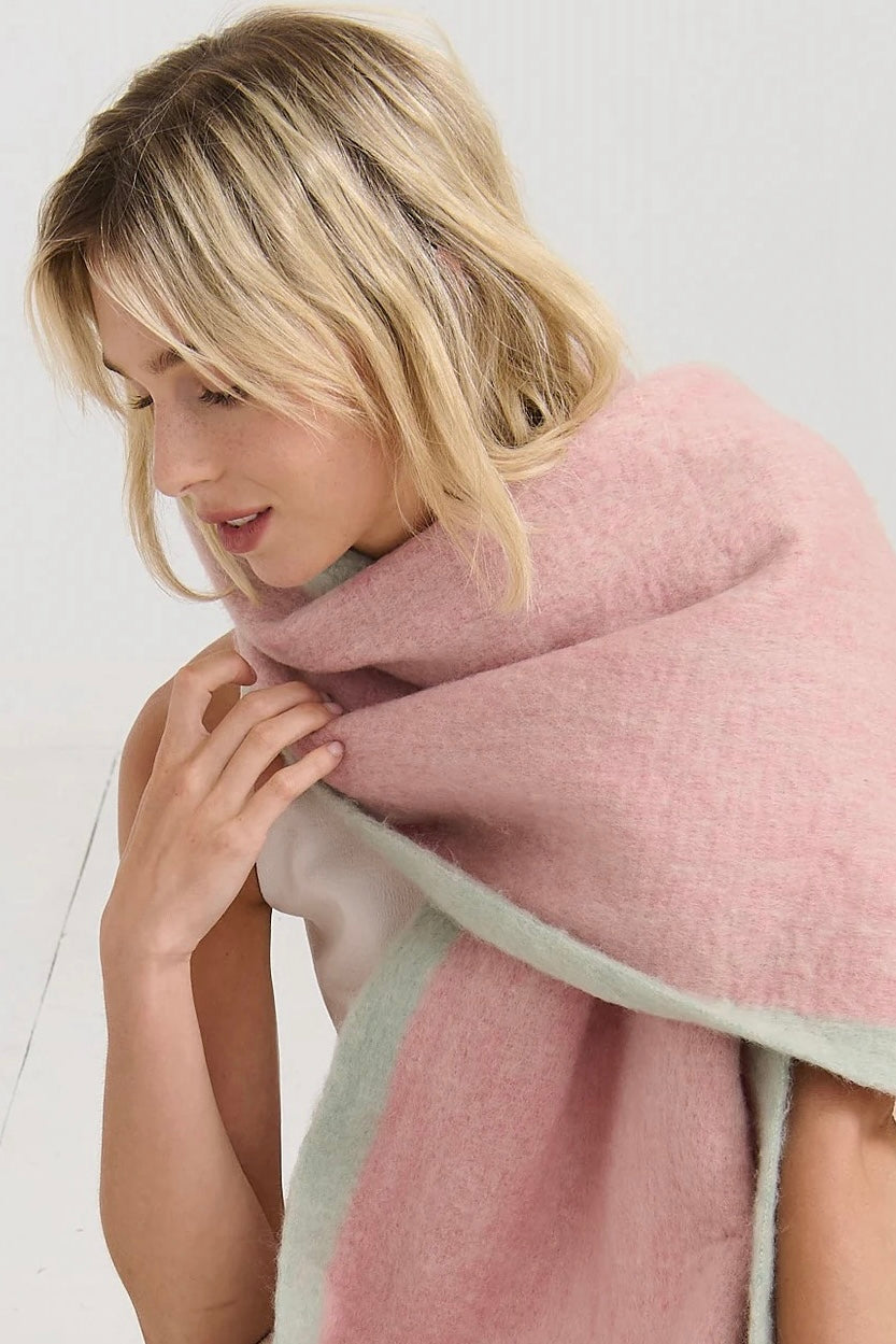 Woman in a blush pink and pastel green winter scarf with brushed texture from Bohemian Love Runway 
