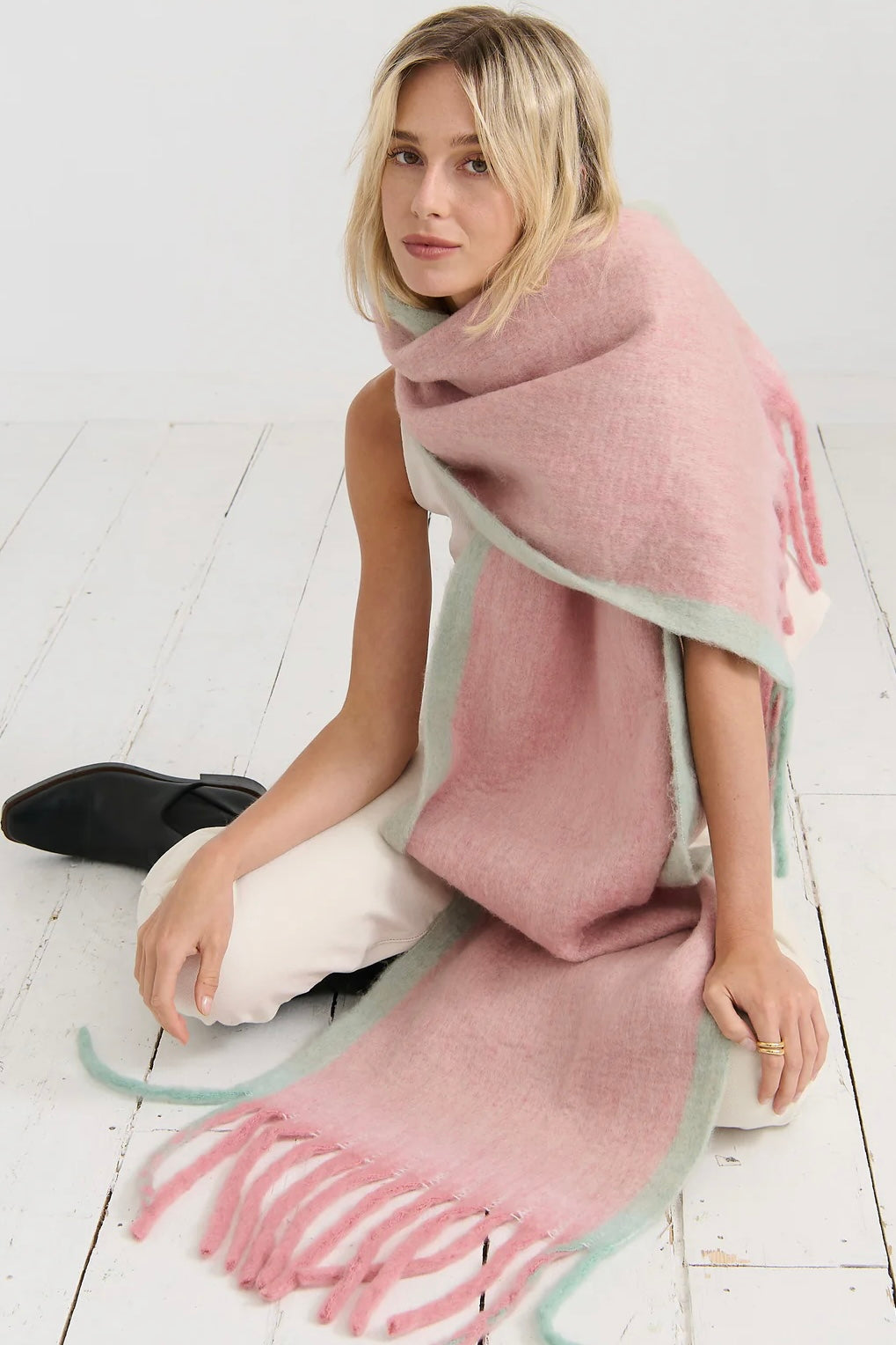 Woman in a blush pink and pastel green winter scarf with brushed texture from Bohemian Love Runway 
