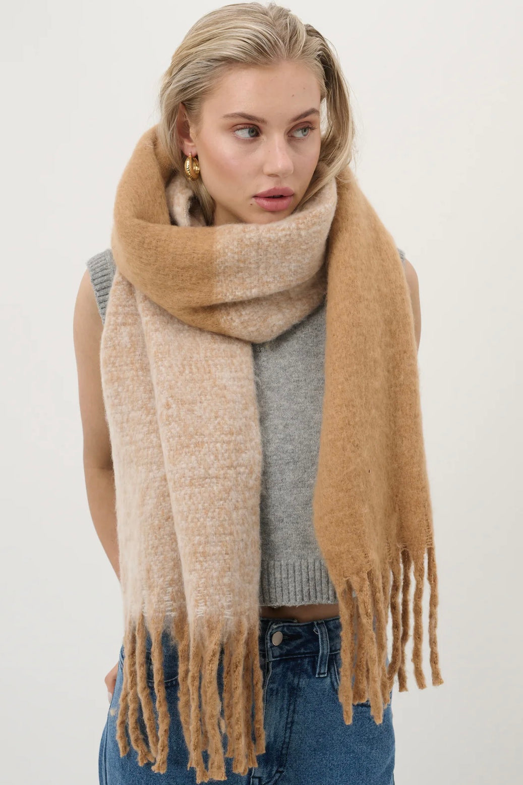 Woman wearing a caramel and beige fluffy boho scarf with fringe - Amber Light soft winter wrap by Bohemian Love Runway.