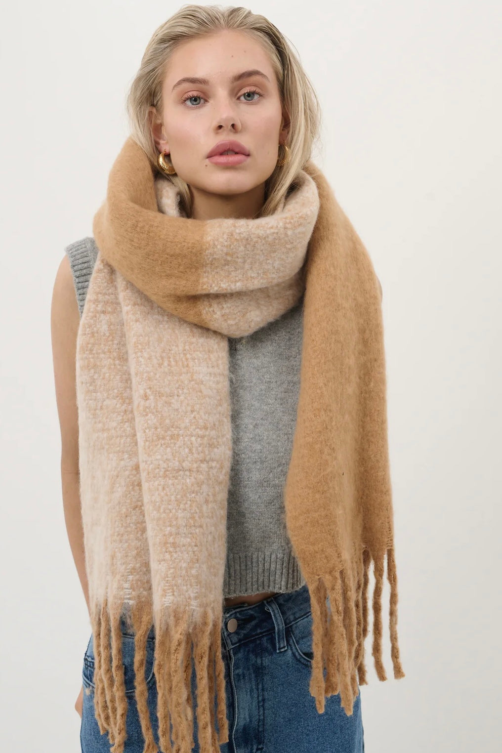 Woman wearing a caramel and beige fluffy boho scarf with fringe - Amber Light soft winter wrap by Bohemian Love Runway.