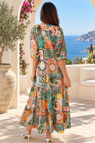 Amira Island Dream tropical patchwork rayon midi dress with V-neck, billowed sleeves and tiered skirt