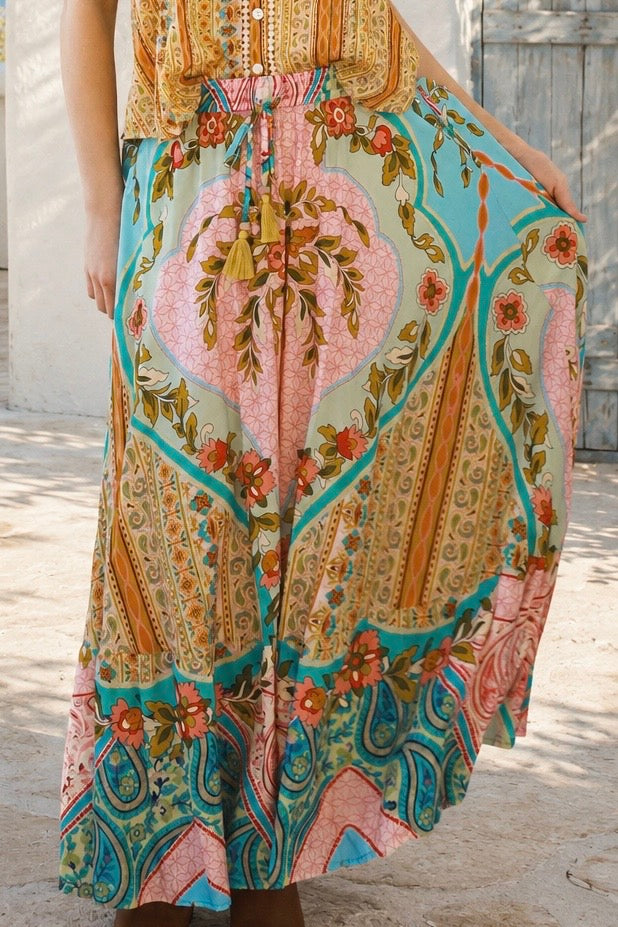 Amara floral boho maxi skirt in 100% rayon with colourful placement print, gathered frill hem and tassel tie