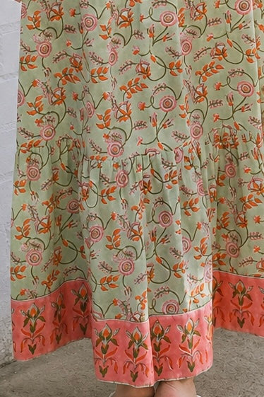 Lauren 100% cotton floral boho maxi dress in sage green with coral botanical print, tassel ties and contrast border hem