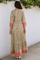 Lauren 100% cotton floral boho maxi dress in sage green with coral botanical print, tassel ties and contrast border hem