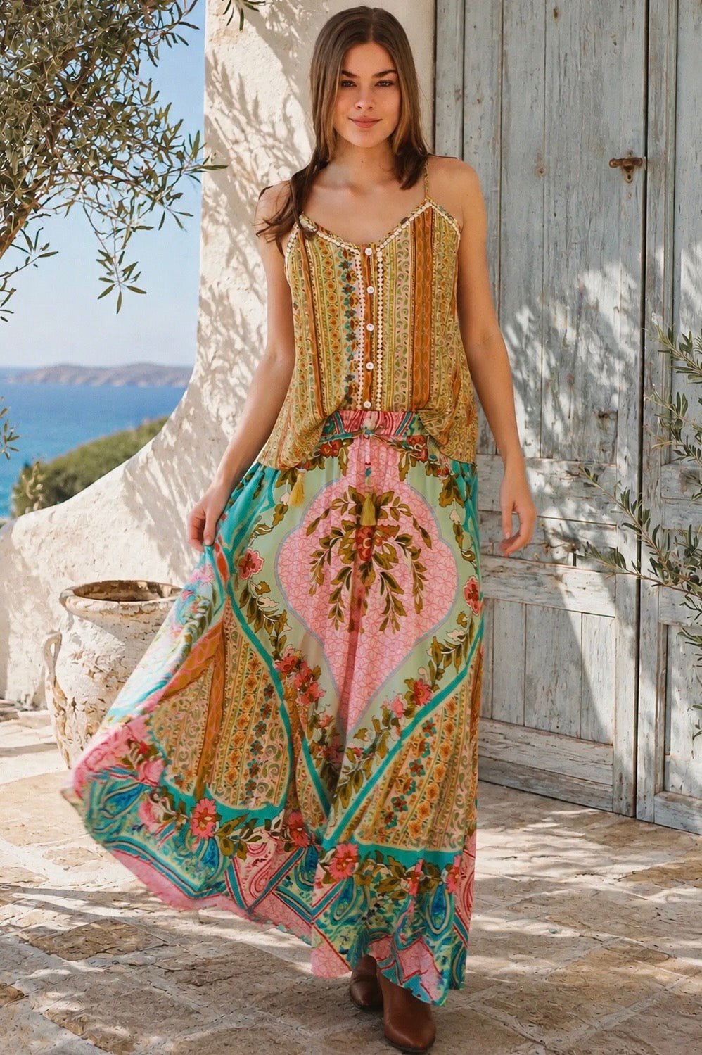 Amara floral boho maxi skirt in 100% rayon with colourful placement print, gathered frill hem and tassel tie
