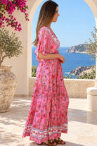 Eliana Bloom pink floral rayon boho maxi dress with V-neckline, smocked waist and tiered skirt.