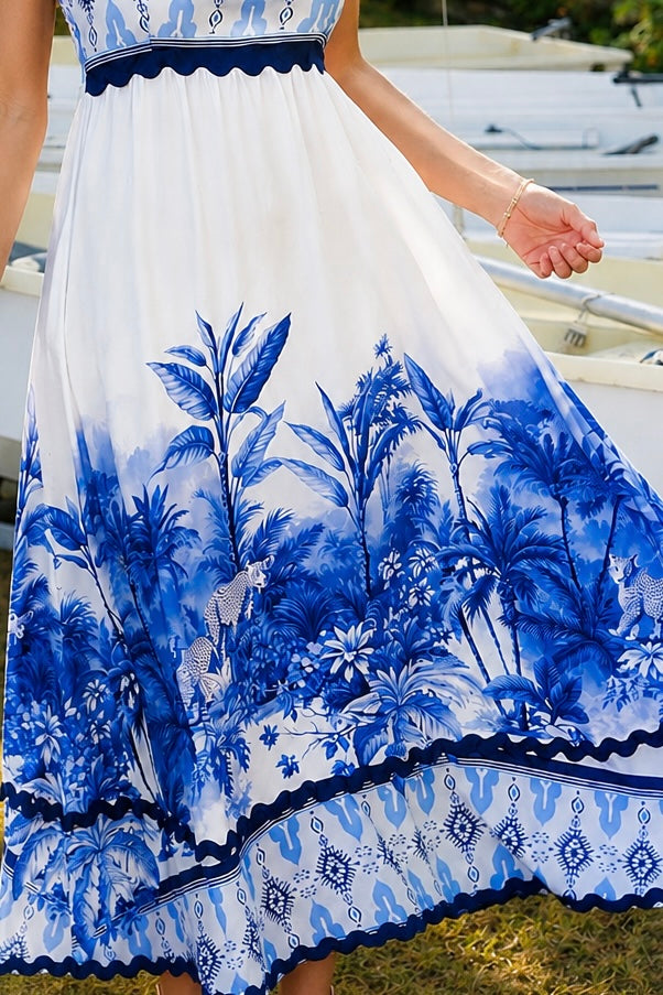Blue and white floral boho maxi dress with statement border print at Bohemian Love Runway 