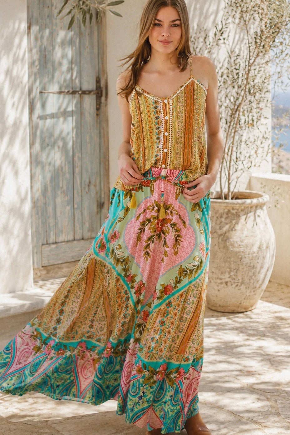 Amara floral boho maxi skirt in 100% rayon with colourful placement print, gathered frill hem and tassel tie