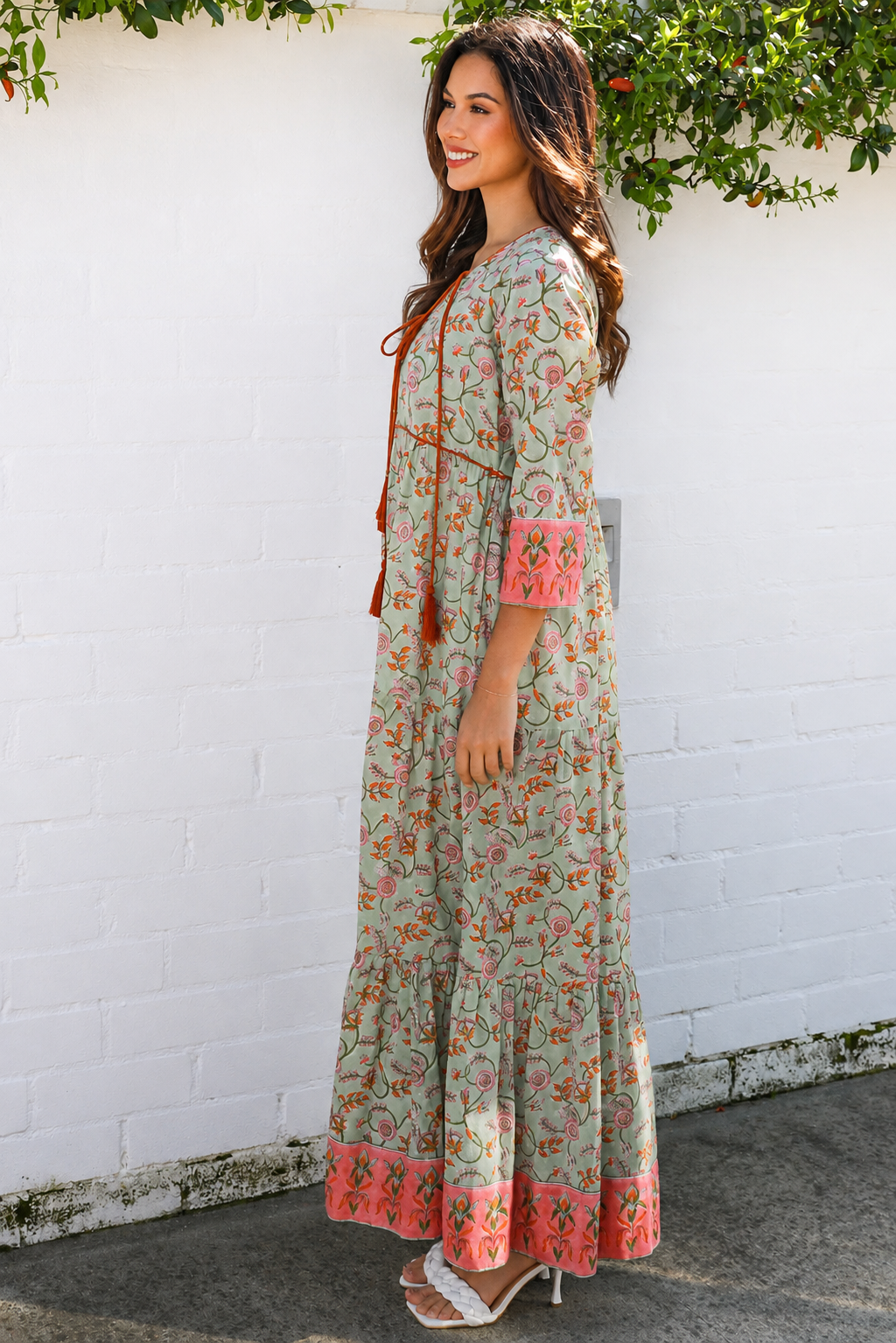 Lauren 100% cotton floral boho maxi dress in sage green with coral botanical print, tassel ties and contrast border hem