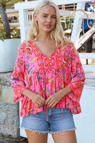Sintra pink floral boho top with V-neck, button front, ties and three-quarter bell sleeves