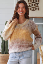 Woman wearing honey mocha cream ombre knit jumper with relaxed V neckline and soft textured winter knit
