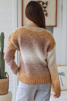 Woman wearing honey mocha cream ombre knit jumper with relaxed V neckline and soft textured winter knit