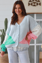 Pastel colour block chunky ribbed knit cardigan in pale blue mint blush and cream women’s boho winter style
