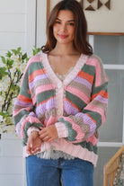 Woman wearing colourful textured wool blend knit cardigan with balloon sleeves and relaxed boho winter styling