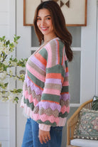 Woman wearing colourful textured wool blend knit cardigan with balloon sleeves and relaxed boho winter styling