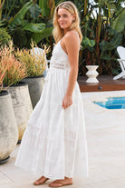 Olivia white embroidered cotton maxi dress with lace waist, tassel V-neck, adjustable straps and tiered skirt