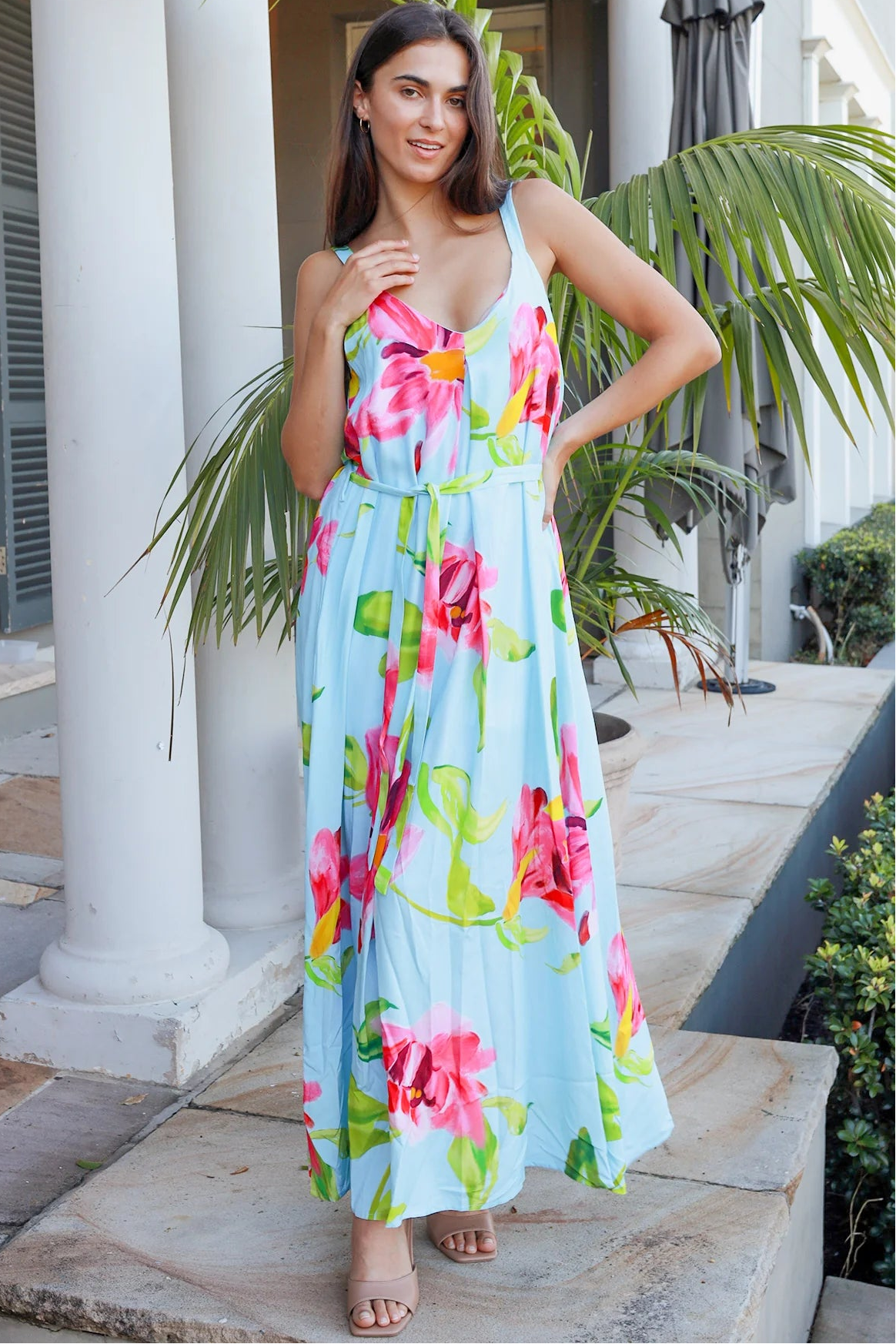 Woman wearing aqua floral v-neck maxi dress with pink and coral blooms – Charlotte the Label boho dresses Australia
