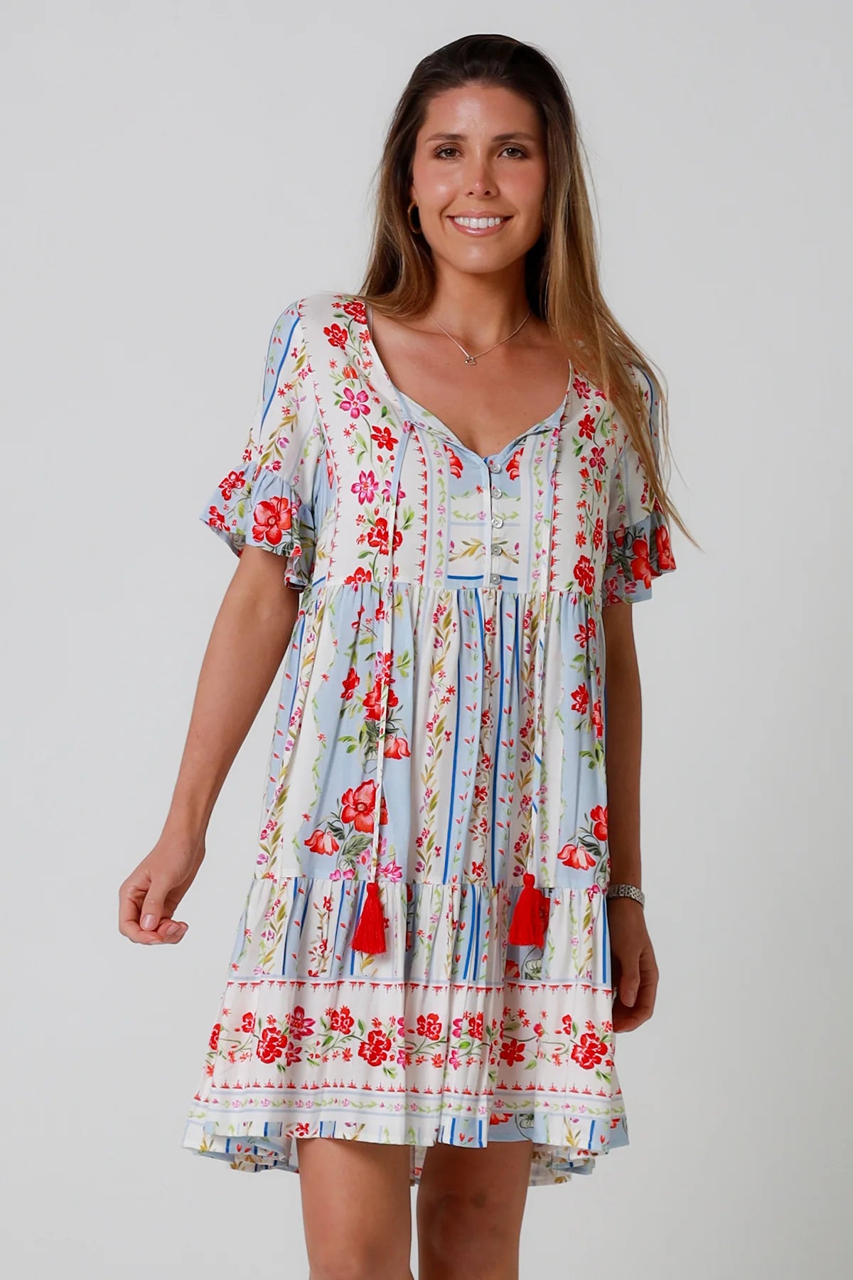 Boho mini dress with tassels v-neckline frill sleeves and border print in florals - Cherry Blossom Mini Dress Australia