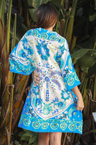 Dreamcatcher Azure Palm rayon mini dress with crochet kimono sleeves and crochet hem