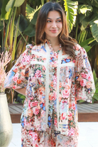 Woman wearing Hannah Blouse in soft rayon with three quarter elastic sleeves and gathered back yoke boho style