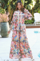 Woman wearing Hannah Blouse in soft rayon with three quarter elastic sleeves and gathered back yoke boho style