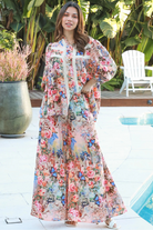 Woman wearing Hannah Blouse in soft rayon with three quarter elastic sleeves and gathered back yoke boho style