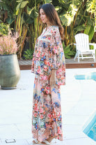 Woman wearing Hannah Blouse in soft rayon with three quarter elastic sleeves and gathered back yoke boho style