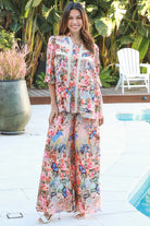 Woman wearing Hanna Pant Rayon with butterfly floral print wide leg silhouette – boho pants Australia