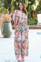 Woman wearing Hanna Pant Rayon with butterfly floral print wide leg silhouette – boho pants Australia