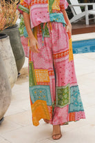 Wide leg patchwork paisley boho pants by Dreamcatcher with elastic waist and colourful bandana print