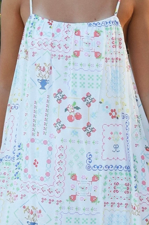 Izadora mini dress by Salty Palm with patchwork print, adjustable straps and A-line shape styled for summer.