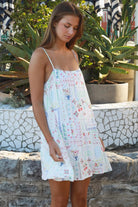 Izadora mini dress by Salty Palm with patchwork print, adjustable straps and A-line shape styled for summer.