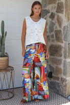 Bright 70s patchwork rayon wide-leg pants in bold multicoloured print — Ingrid Pant summer boho style.