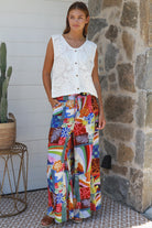 Bright 70s patchwork rayon wide-leg pants in bold multicoloured print — Ingrid Pant summer boho style.